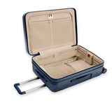 Black Briggs & Riley Sympatico medium expandable spinner checked luggage with four wheels and a sleek design.