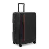 Black Briggs & Riley ZDX large 30-inch hardside expandable spinner checked luggage with four wheels and TSA lock.