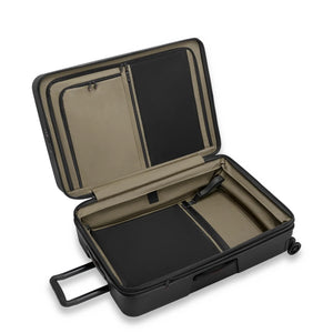Black Briggs & Riley ZDX large 30-inch hardside expandable spinner checked luggage with four wheels and telescopic handle.