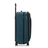 Black Briggs & Riley ZDX large expandable spinner checked luggage with four wheels and telescoping handle.