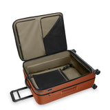 Black Briggs & Riley ZDX large expandable spinner checked luggage with four wheels and telescoping handle for easy travel.