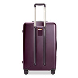 Briggs & Riley Sympatico large expandable spinner checked luggage in plum color with four wheels and a telescopic handle.