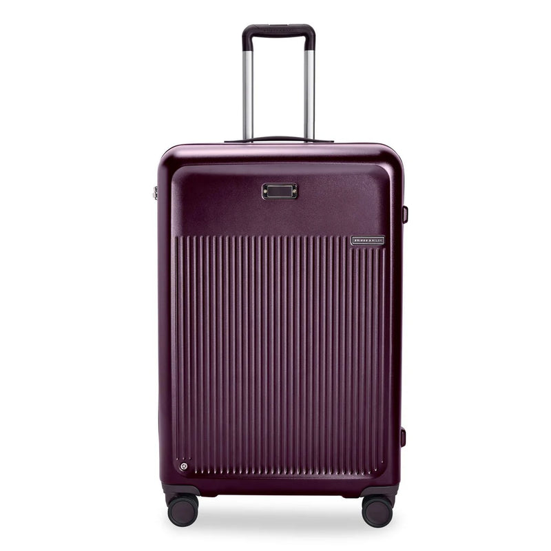 Briggs & Riley Sympatico large expandable plum checked luggage with spinner wheels and sturdy handle, designed for travel.