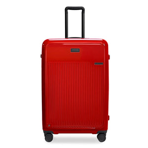 Briggs & Riley Sympatico large expandable spinner checked luggage in glossy ruby red with four wheels and a sleek design.