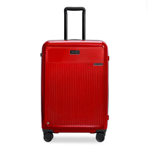 Briggs & Riley Sympatico medium expandable spinner checked luggage in glossy ruby red with four wheels and a sleek design.