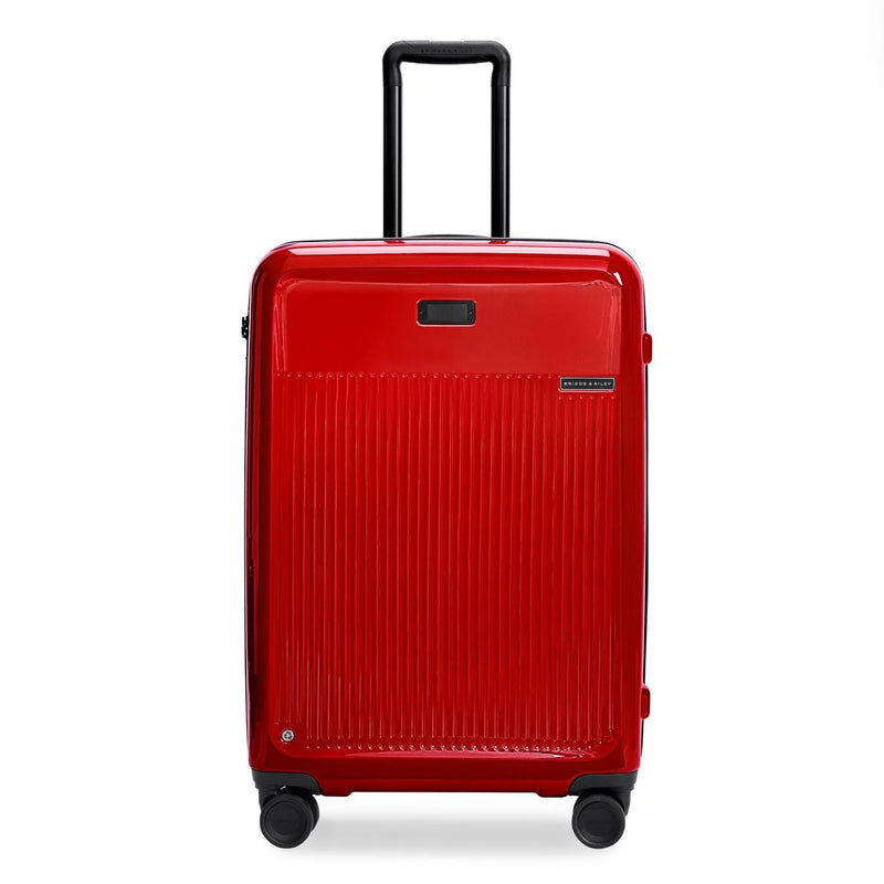 Briggs & Riley Sympatico medium expandable spinner checked luggage in glossy ruby red with four wheels and a sleek design.