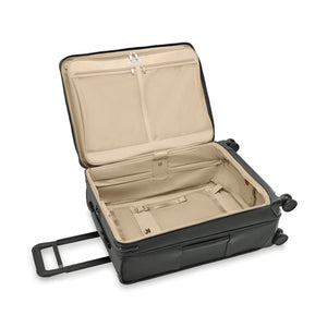 Navy Briggs & Riley Baseline compact checked expandable spinner luggage with four wheels and a sturdy handle.