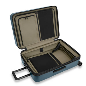 Briggs & Riley ZDX medium 27-inch ocean blue hardside expandable spinner checked luggage with four wheels and TSA lock.