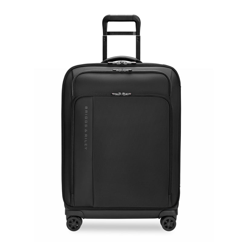 Briggs & Riley ZDX medium expandable checked luggage spinner with ocean blue hard shell exterior and four rotating wheels.