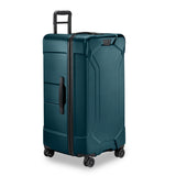 Briggs & Riley Torq extra large checked luggage trunk spinner with durable hard shell and four 360-degree wheels.