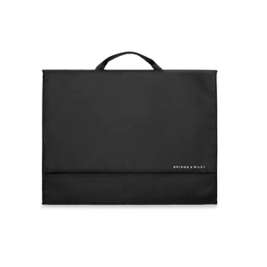 Briggs & Riley garment folder neatly folded with clothing inside, designed for wrinkle-free travel organization.