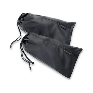 Briggs & Riley set of 2 shoe covers in clear material, designed to protect shoes during travel or storage.