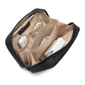 Briggs & Riley Tech Kit featuring multiple compartments, black nylon exterior, and zipper closures for organizing electronic accessories.