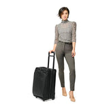 Briggs & Riley Baseline carry-on upright garment bag with wheels and handle, designed for travel and hanging clothes.