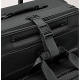 Briggs & Riley Baseline carry-on upright garment bag with wheels, black fabric, and handle for convenient travel storage.
