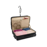 Briggs & Riley Baseline carry-on upright garment bag with handle and wheels, designed for travel and clothing protection.