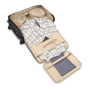 Briggs & Riley Baseline carry-on upright garment bag with wheels and handle, designed for travel and clothing protection.