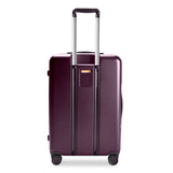 Briggs & Riley Sympatico medium expandable plum hardside spinner luggage with four wheels and secure zipper closure.
