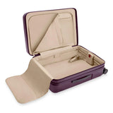 Briggs & Riley Sympatico medium expandable plum hardside spinner luggage with four wheels and TSA lock for travel.