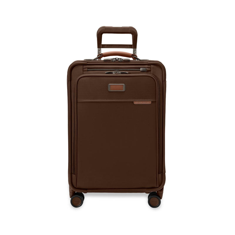 Briggs & Riley Baseline Essential Carry-On Spinner in limited edition chocolate with front view showing smooth, durable hard-shell exterior.