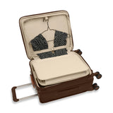 Briggs & Riley Baseline Global Carry-On Spinner luggage in limited edition chocolate color with four spinner wheels and a telescopic handle.