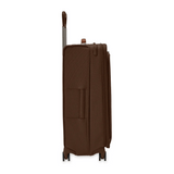 Briggs & Riley Baseline large expandable chocolate spinner suitcase with four wheels and built-in handle for travel.