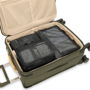 Briggs & Riley carry-on compression packing cube set for efficient travel organization, with multiple cubes in a sleek design.