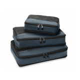 Briggs & Riley check-in packing cube set with multiple organized compartments for travel storage, shown in a travel bag.