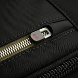 Briggs & Riley HTA sling bag featuring a sleek design with a hooded zipper and adjustable strap, ideal for everyday carrying.