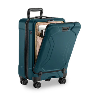 Briggs & Riley Torq international carry-on spinner with front pocket, hard-shell design, and multi-directional wheels.