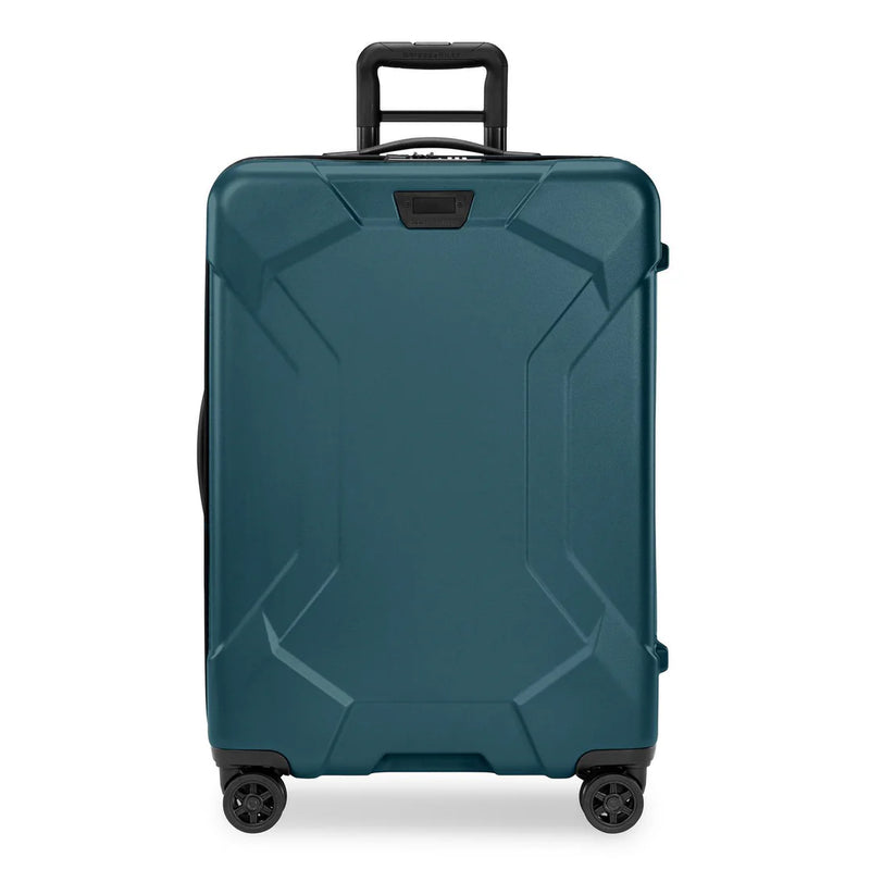 Briggs & Riley Torq medium spinner suitcase in stealth black with four wheels and telescoping handle for easy travel.