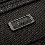 Briggs & Riley Baseline Traveler Tote bag in black with monogram design, featuring sturdy handles and spacious interior.