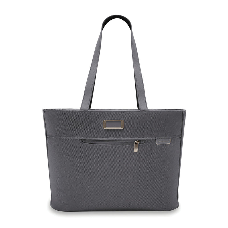 Briggs & Riley Baseline Traveler Tote in steel gray, showing a sleek, spacious nylon carryall with handles and multiple compartments.