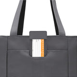 Briggs & Riley Baseline Traveler Tote in sleek steel gray, durable tote bag with multiple compartments and sturdy handles.