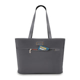 Briggs & Riley Baseline Traveler Tote in sleek steel gray with multiple compartments and sturdy handles, designed for travel and daily use.