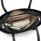 Interior view of Briggs & Riley Rhapsody vertical tote bag showing multiple compartments and organized storage space.