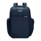 Briggs & Riley Baseline Traveler Backpack shown from the front, featuring multiple compartments and padded shoulder straps.
