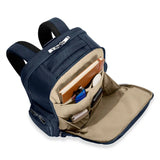 Briggs & Riley Baseline traveler backpack with front pocket organizer, black fabric, multiple compartments, and padded shoulder straps.