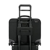 Black Briggs & Riley @work large spinner briefcase with wheels and multiple compartments, designed for professional travel and organization.