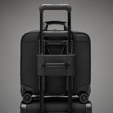 Black Briggs & Riley @work medium spinner briefcase with wheels, designed for professional travel and work organization.