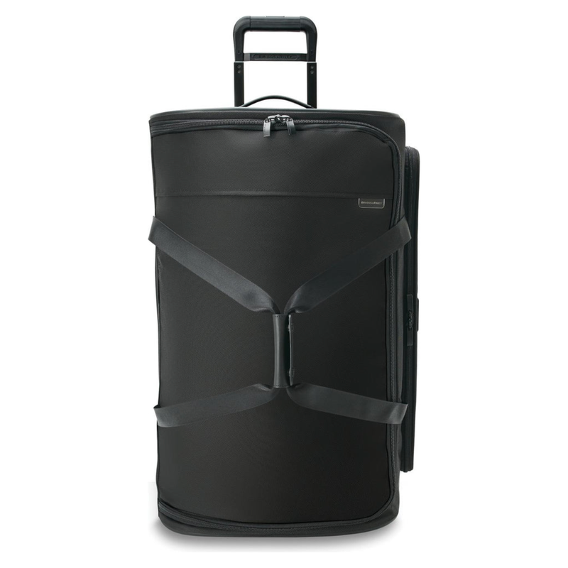 Briggs & Riley Baseline large two-wheel duffle bag with durable fabric and sturdy wheels for travel and storage.