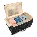 Briggs & Riley Baseline large two-wheel duffle bag with sturdy wheels and spacious main compartment for travel gear.
