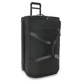 Briggs & Riley Baseline large two-wheel duffle bag with durable fabric and sturdy wheels, suitable for travel and extended trips.