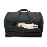 Briggs & Riley Baseline large two-wheel duffle bag with durable fabric and padded handles, suitable for travel and weekend trips.