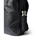 Cotopaxi Allpa 28L travel backpack in black with multiple compartments and padded shoulder straps, designed for versatile travel use.