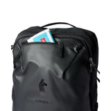 Cotopaxi Allpa 28L travel backpack in black, featuring multiple compartments and padded straps for comfortable carrying.