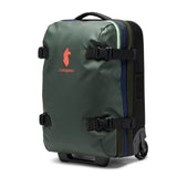 Cotopaxi Allpa 38L roller bag, carry-on luggage in durable fabric with wood-tone accents and sturdy wheels for travel.