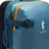 Cotopaxi Allpa 38L roller carry-on luggage in Blue Spruce with durable wheels and telescopic handle for easy travel.