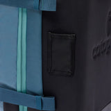 Cotopaxi Allpa 38L Roller Bag in Blue Spruce, a durable carry-on luggage with wheels and a sturdy handle for travel.