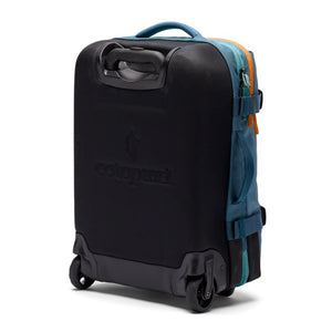 Cotopaxi Allpa 38L Roller Bag in Blue Spruce, carry-on luggage with durable wheels and handle for easy travel.